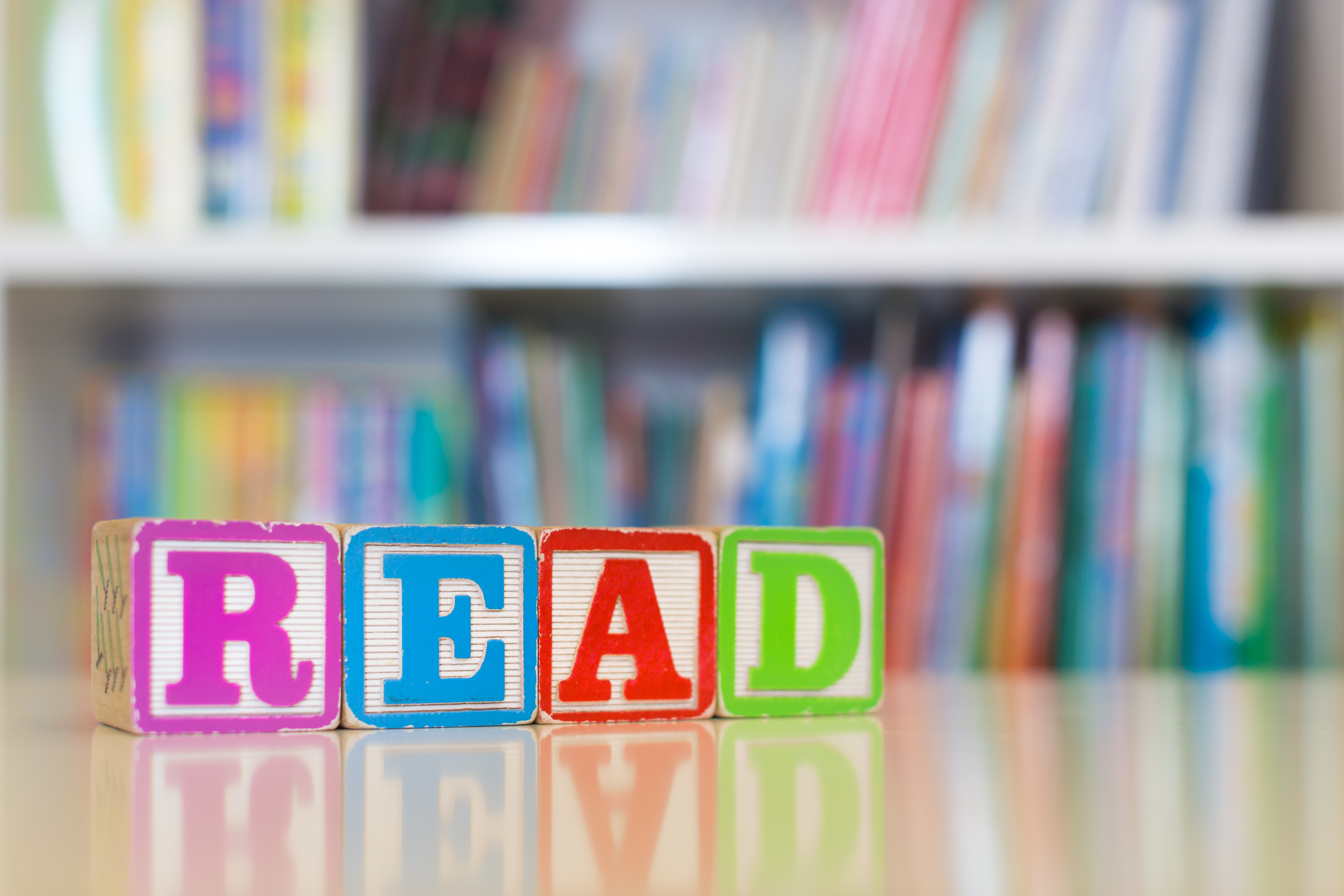 wooden blocks arranged to spell "read"